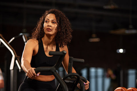 Woman performing cardio in the gym working on her aerobic endurance