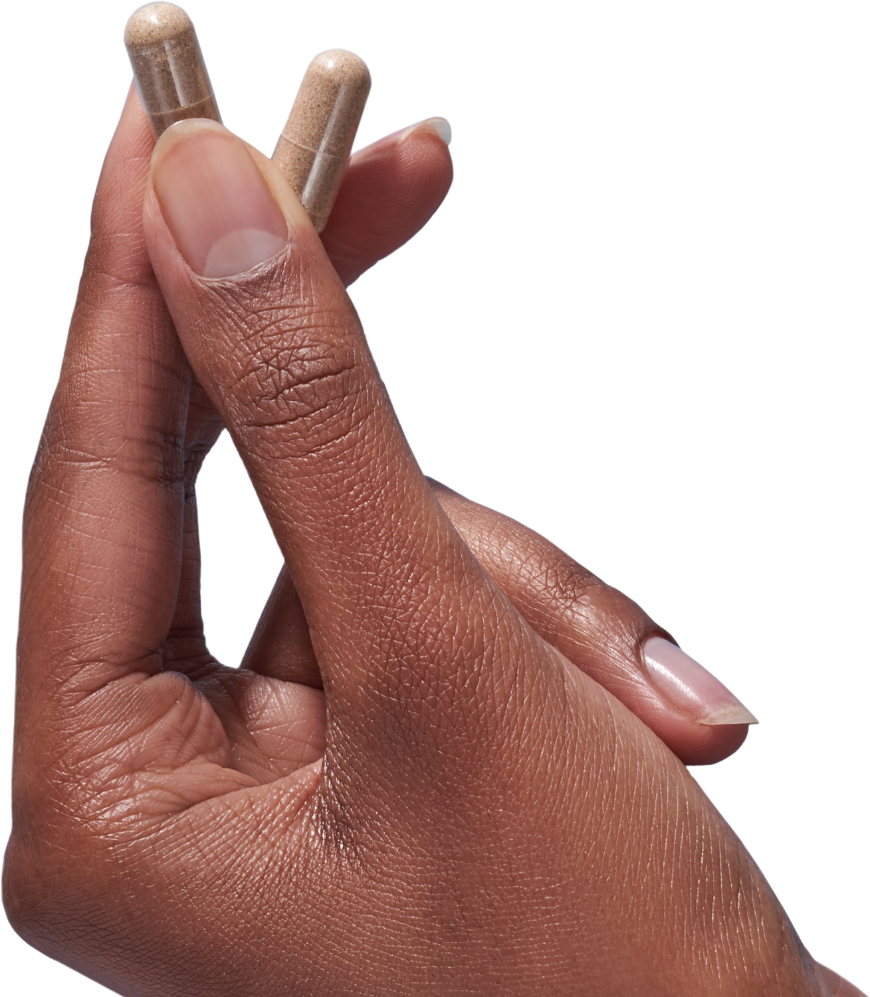 image of hand holding 2 Mind Lab Pro® capsules