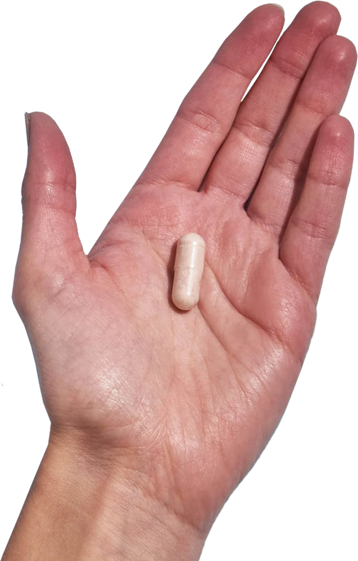 image of hand holding 1 Performance Lab® Selenium capsule
