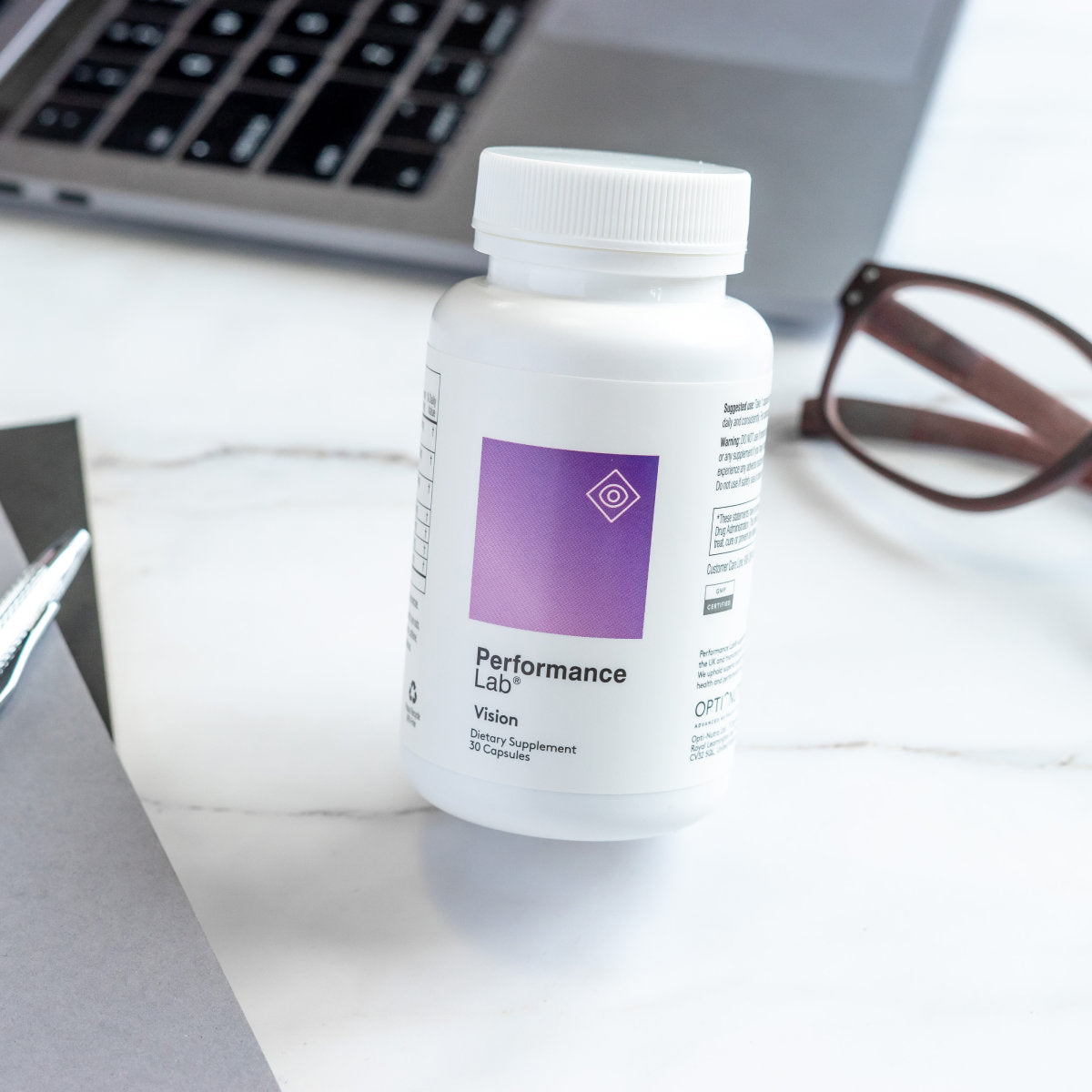 image of Performance Lab® bottle on an office desk