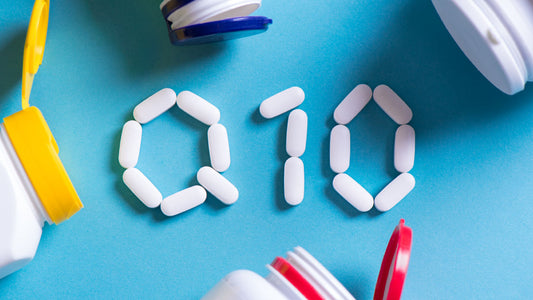 Best Time to Take CoQ10: A Detailed Guide. Supplement bottles surround oblong tablets that spell “Q10”.  