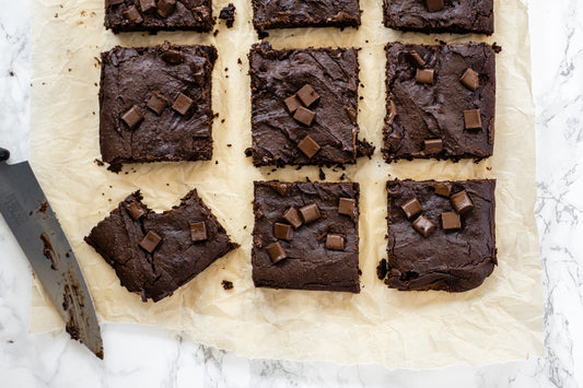 Black bean brownie slices on parchment paper