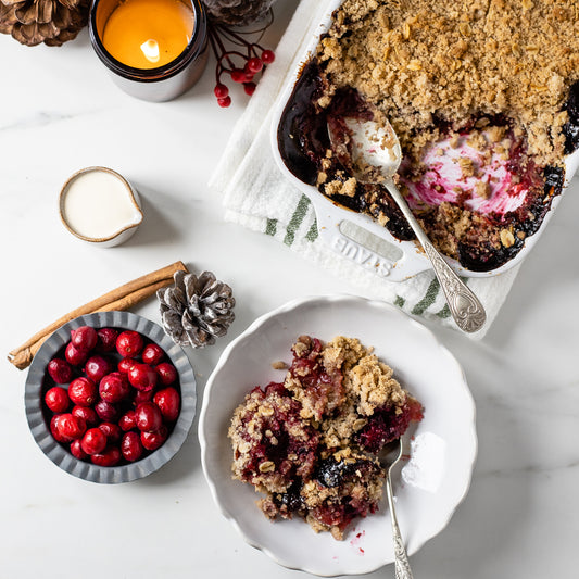 Festive apple, blackberry and cranberry crumble with cream