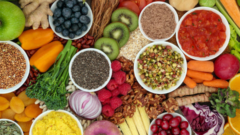 Flaxseeds, kiwi, blueberries,walnuts. An array of foods to demonstrate Foods High in Omega 3 (that are not fish).