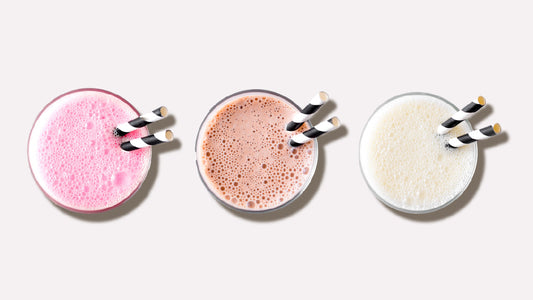 3 shakes lined up made with either protein powder with milk or water 