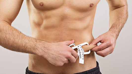 Man using a a caliper to 'measure body fat percentage.'