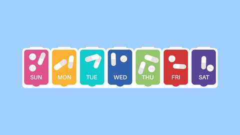 A weekly pill organizer with colorful containers for each day. Suggesting the question of, "When is the best time to take zinc?".