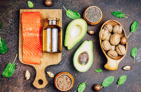 why is omega 3 so good for you? A bottle of Omega 3 oil and food sources