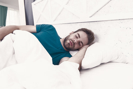 Taking vitamin B6 for Sleep: Benefits, Dosage, and Its Role In Improving Your Sleep Cycle. A man sleeps soundly in bed