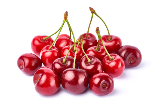 Do cherries have melatonin? Discover the sleep benefits of cherries. A group of red cherries against a white background