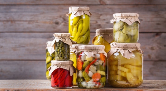 Fermented foods and weight loss. Several jars of fermented foods