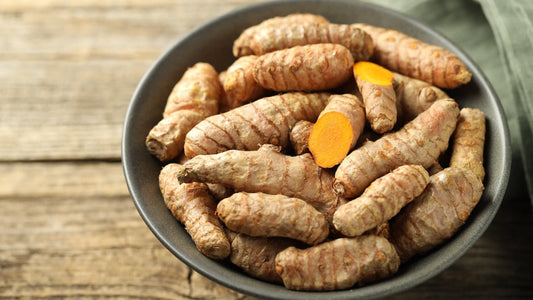 What health benefit is turmeric known for? Turmeric roots in a bowl.