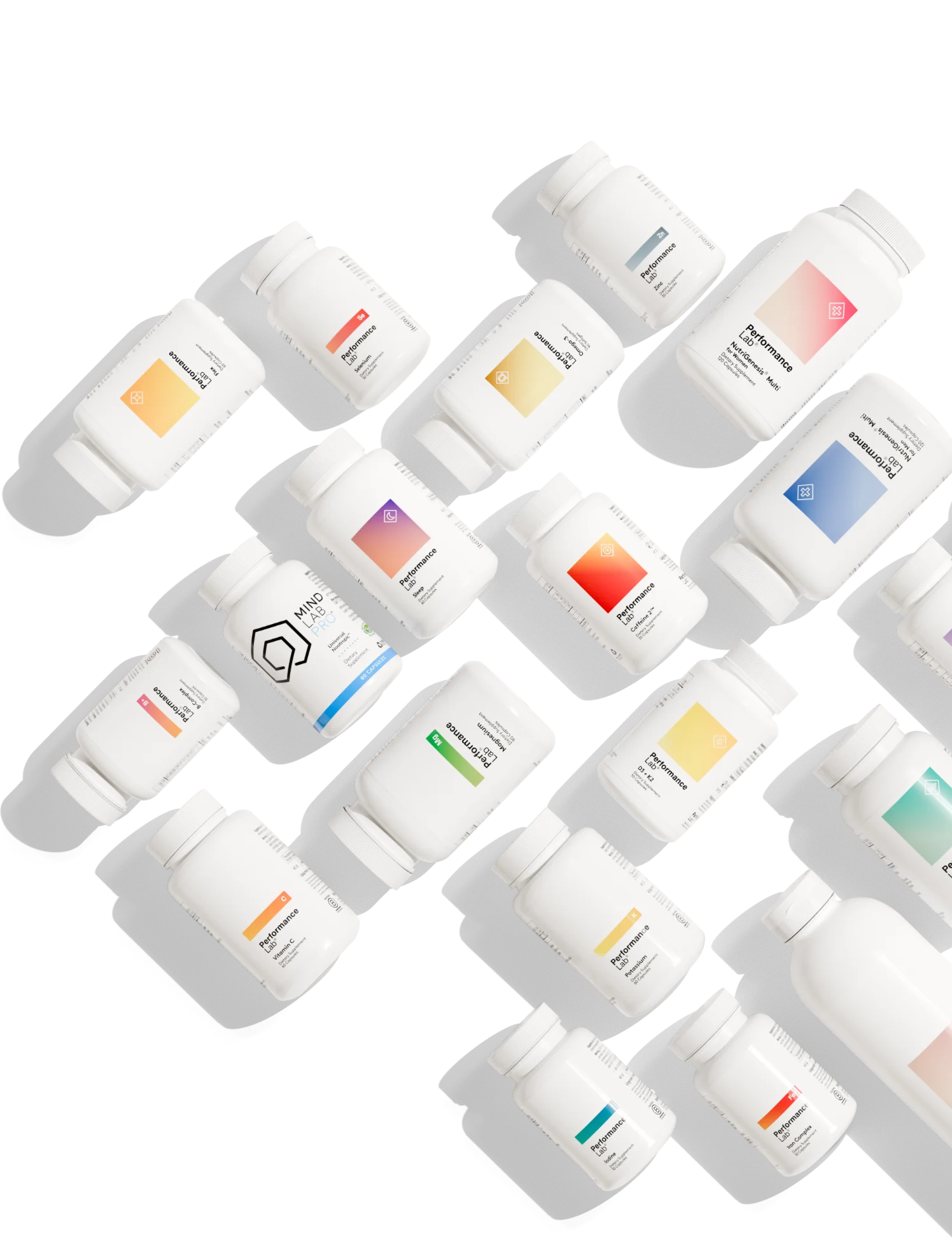 An assortment of Performance Lab and Mind Lab Pro supplement bottles scattered diagonally across a grey background.