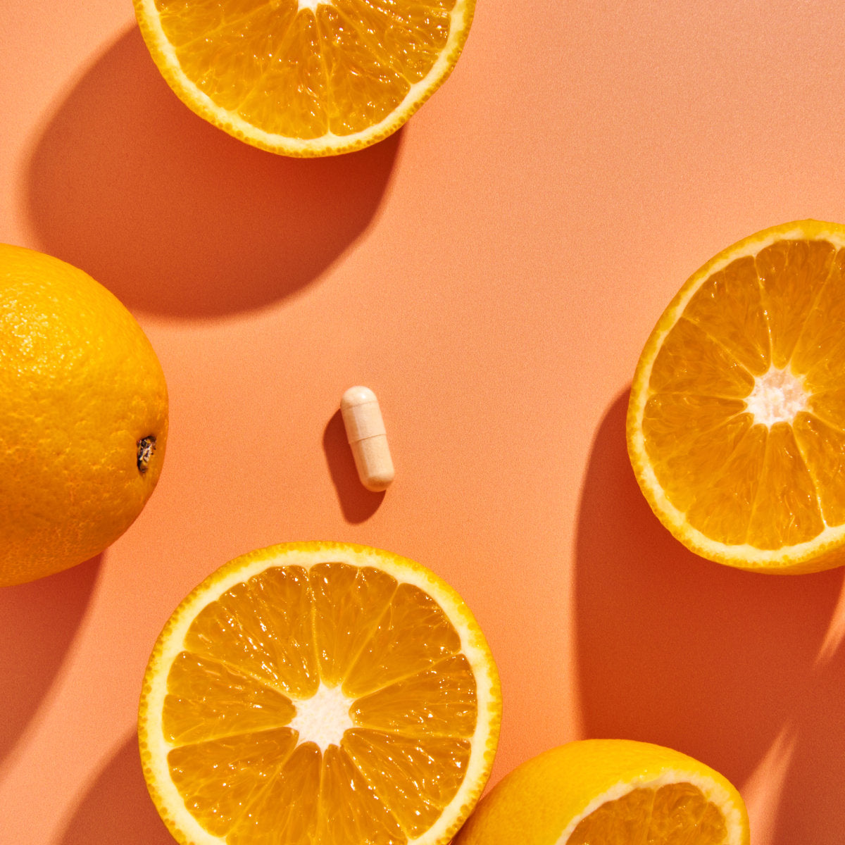 image of a Immune capsule on a table with some oranges