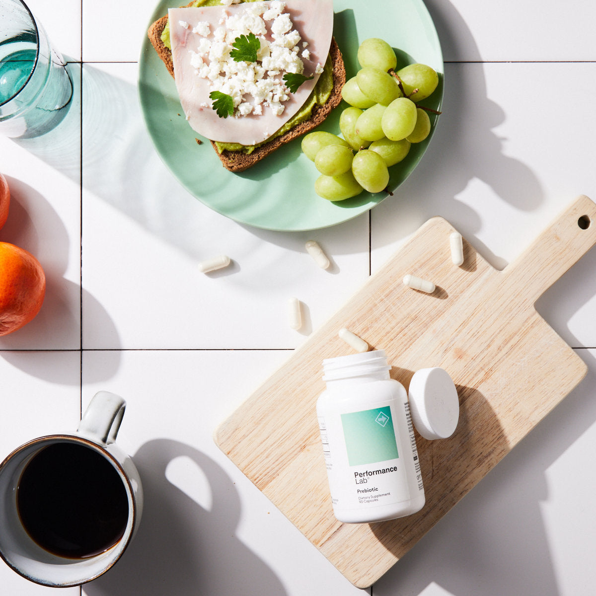image of Performance Lab® Prebiotic bottle on a breakfast table